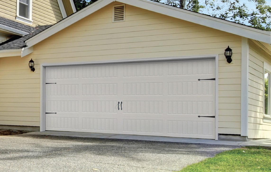 ProDoor white panel garage doors with carriage-styled trim